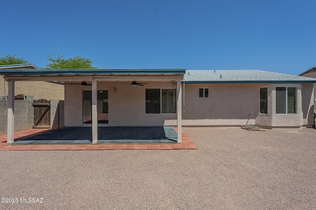 8954 E Pomegranate St, Tucson, AZ 85730 - back of house with a ceiling fan, stucco siding, a gate, and a patio