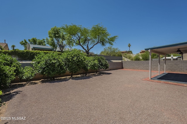 8954 E Pomegranate St, Tucson, AZ 85730 - fenced backyard featuring a patio area and ceiling fan