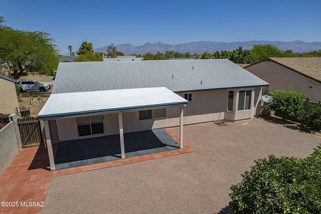 8954 E Pomegranate St, Tucson, AZ 85730 - rear view of house with a patio area, a fenced backyard, a mountain view, a gate, and stucco siding