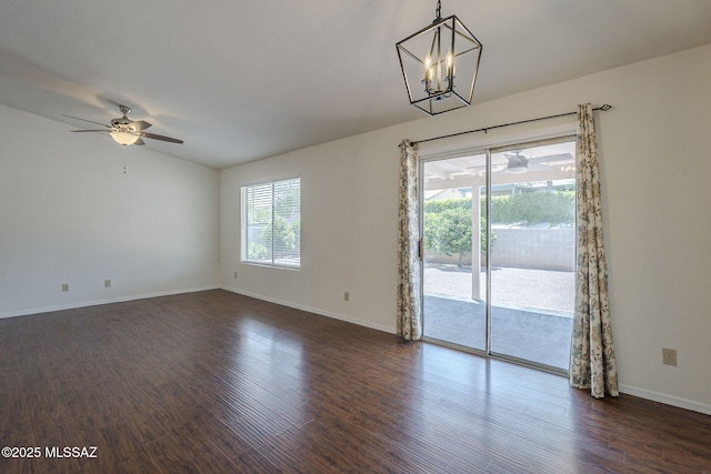8954 E Pomegranate St, Tucson, AZ 85730 - empty room with ceiling fan, lofted ceiling, dark wood-style floors, and a chandelier