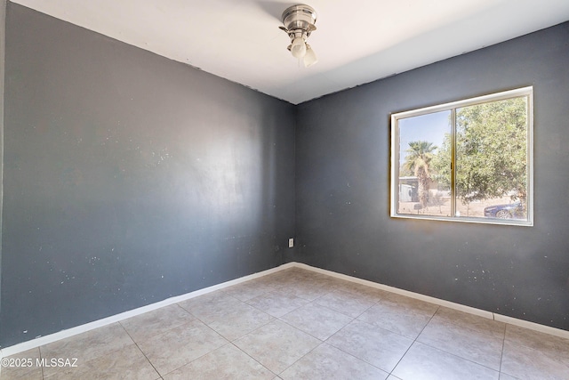 2340 S Window Rock Pl, Tucson, AZ 85710 - tiled empty room featuring baseboards and ceiling fan