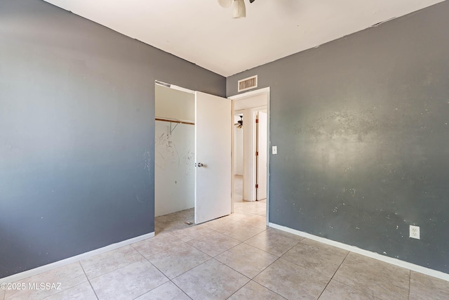 2340 S Window Rock Pl, Tucson, AZ 85710 - spare room featuring light tile patterned flooring and baseboards