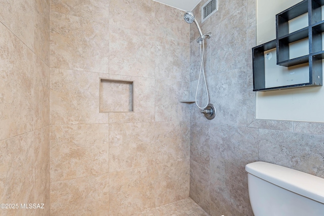 2340 S Window Rock Pl, Tucson, AZ 85710 - bathroom with a tile shower and toilet