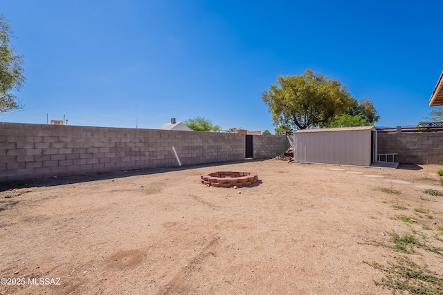 2340 S Window Rock Pl, Tucson, AZ 85710 - fenced backyard with a fire pit