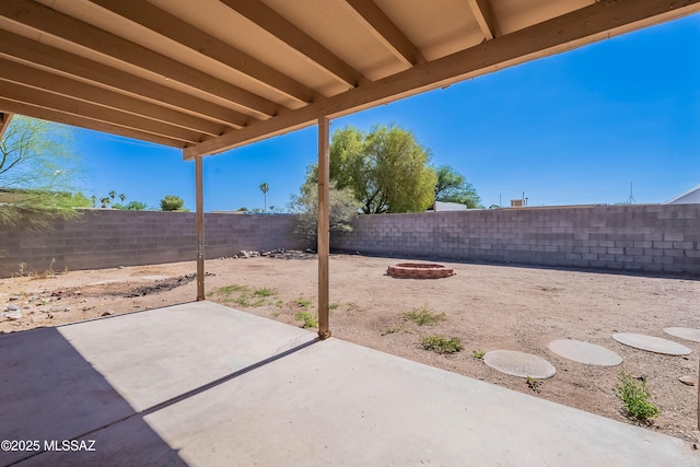 2340 S Window Rock Pl, Tucson, AZ 85710 - fenced backyard featuring a patio and a fire pit