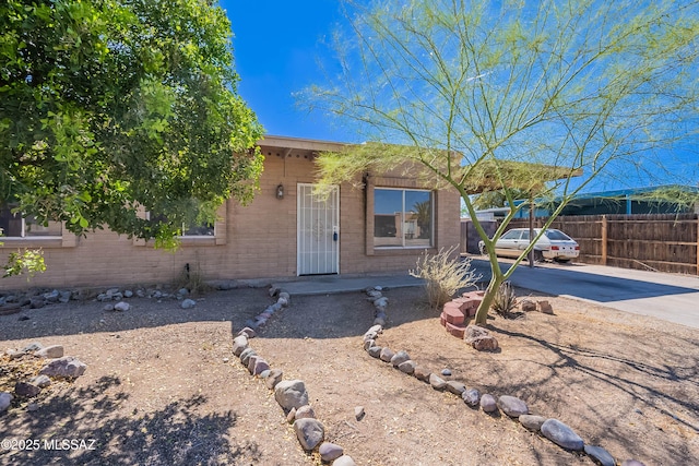 2340 S Window Rock Pl, Tucson, AZ 85710 - view of front of house with brick siding