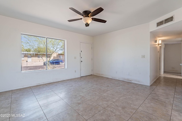 2340 S Window Rock Pl, Tucson, AZ 85710 - unfurnished room with ceiling fan and light tile patterned flooring