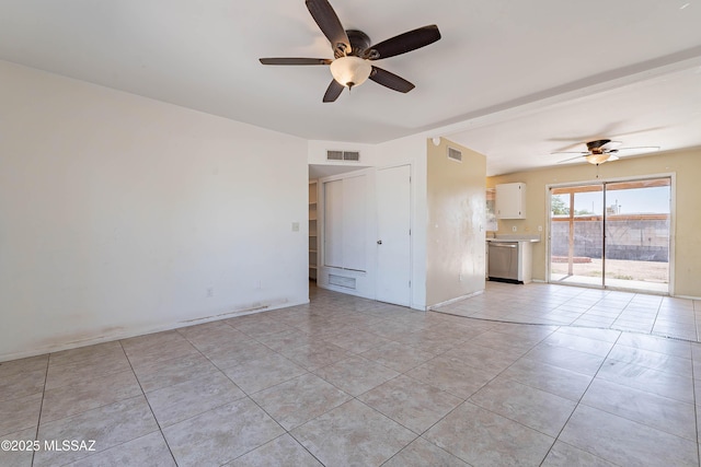 2340 S Window Rock Pl, Tucson, AZ 85710 - unfurnished room featuring ceiling fan, light tile patterned floors, and baseboards