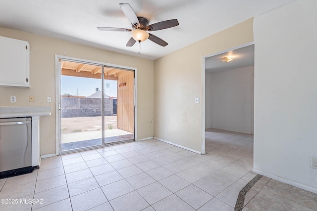 2340 S Window Rock Pl, Tucson, AZ 85710 - unfurnished dining area with a ceiling fan, light tile patterned floors, and baseboards
