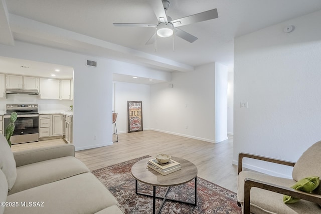 4203 N River Grove Cir Unit 103, Tucson, AZ 85719 - living area featuring light wood-style floors, a ceiling fan, recessed lighting, and baseboards