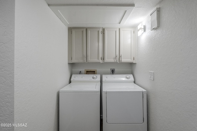 4203 N River Grove Cir Unit 103, Tucson, AZ 85719 - laundry area featuring cabinet space, a textured wall, and washing machine and clothes dryer
