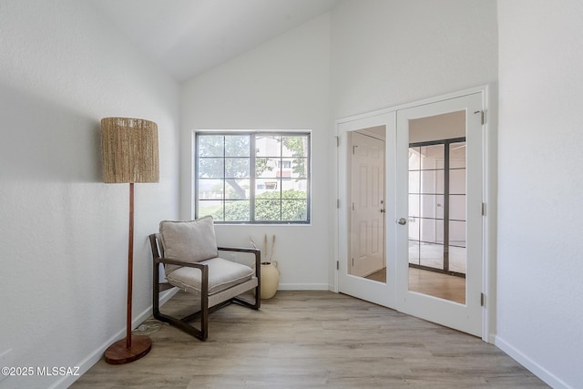 4203 N River Grove Cir Unit 103, Tucson, AZ 85719 - sitting room featuring baseboards, wood finished floors, high vaulted ceiling, and french doors