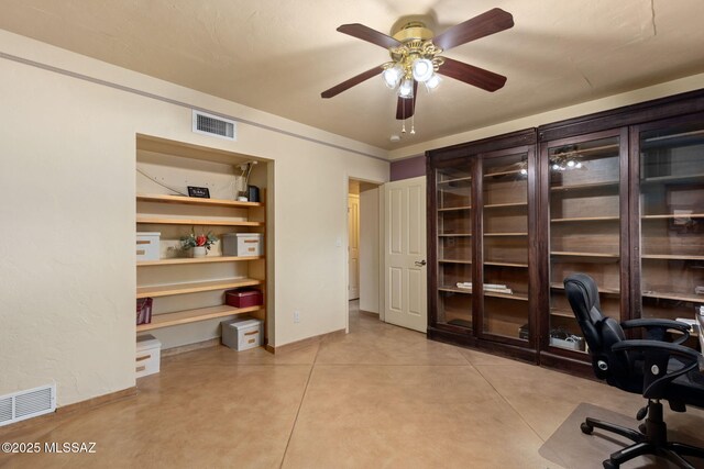 6341 E Brian Kent St, Tucson, AZ 85710 - home office with a ceiling fan, concrete floors, and baseboards