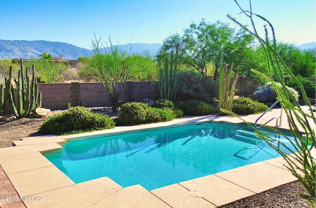 14243 E Whisper Trl, Vail, AZ 85641 - view of swimming pool featuring a mountain view and a fenced backyard
