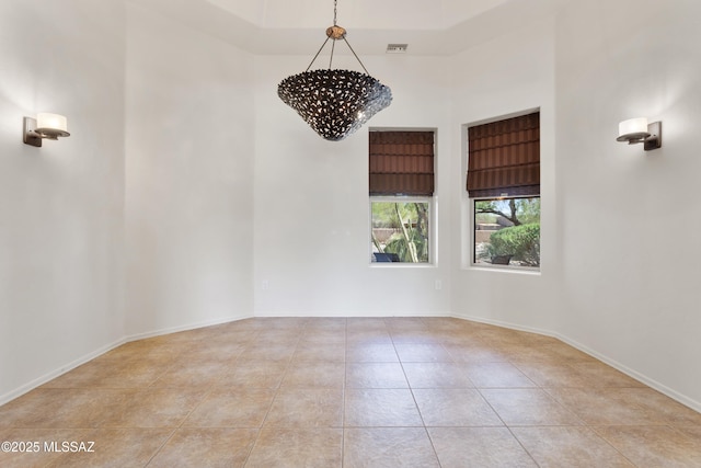 14243 E Whisper Trl, Vail, AZ 85641 - tiled spare room with a high ceiling and a chandelier