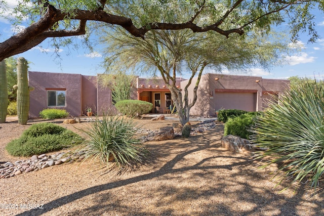 14243 E Whisper Trl, Vail, AZ 85641 - pueblo-style house featuring a garage and stucco siding
