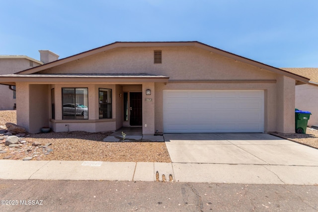 8172 N Streamside Ave, Tucson, AZ 85741 - view of front of property with stucco siding, driveway, and an attached garage