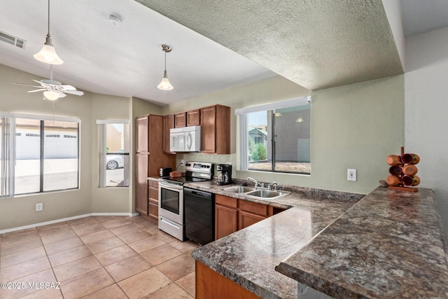 8172 N Streamside Ave, Tucson, AZ 85741 - kitchen with white microwave, electric range, a sink, dishwashing machine, and brown cabinetry