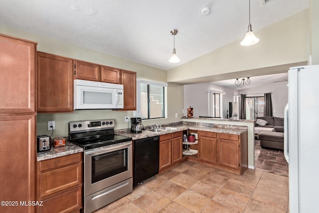 8172 N Streamside Ave, Tucson, AZ 85741 - kitchen with white microwave, black dishwasher, electric range, refrigerator, and a peninsula