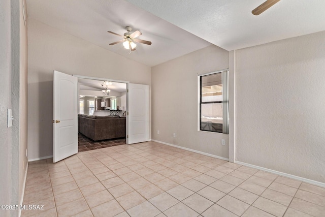 8172 N Streamside Ave, Tucson, AZ 85741 - spare room with ceiling fan, healthy amount of natural light, lofted ceiling, and light tile patterned floors