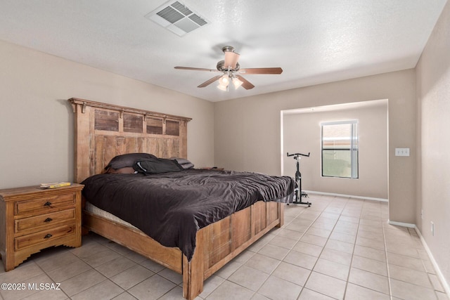 8172 N Streamside Ave, Tucson, AZ 85741 - bedroom featuring light tile patterned flooring, ceiling fan, and baseboards