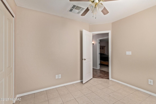 8172 N Streamside Ave, Tucson, AZ 85741 - unfurnished room featuring ceiling fan, baseboards, and light tile patterned floors