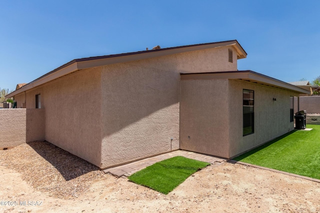 8172 N Streamside Ave, Tucson, AZ 85741 - view of property exterior featuring stucco siding and a patio