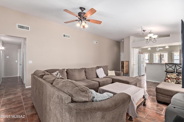 8172 N Streamside Ave, Tucson, AZ 85741 - living room with a chandelier, a ceiling fan, and baseboards