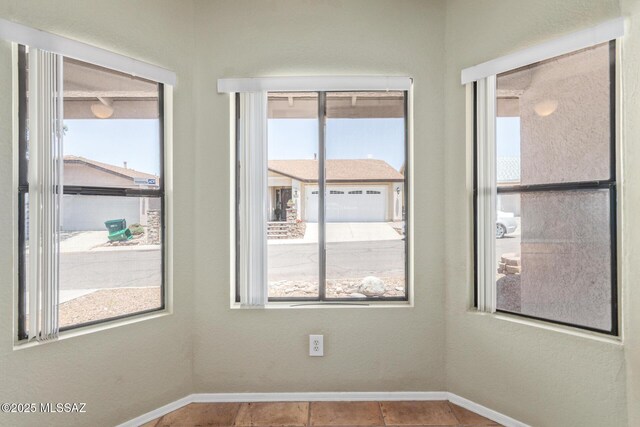 8172 N Streamside Ave, Tucson, AZ 85741 - unfurnished room with baseboards
