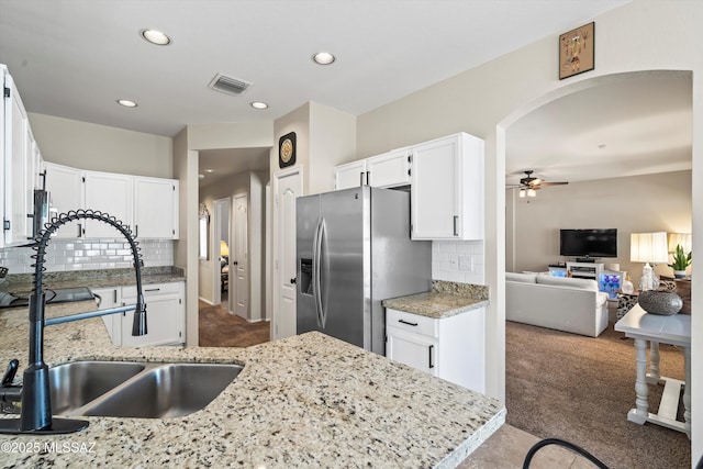 9860 N Western Sky Pl, Tucson, AZ 85742 - kitchen featuring stainless steel fridge with ice dispenser, carpet, a sink, tasteful backsplash, and recessed lighting