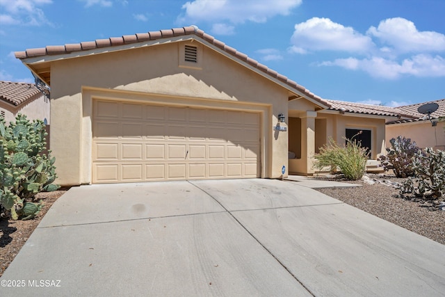 9860 N Western Sky Pl, Tucson, AZ 85742 - view of front facade with driveway, stucco siding, a garage, and a tiled roof