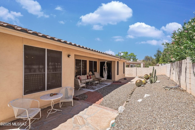 9860 N Western Sky Pl, Tucson, AZ 85742 - rear view of property featuring a patio, stucco siding, a fenced backyard, and a tile roof