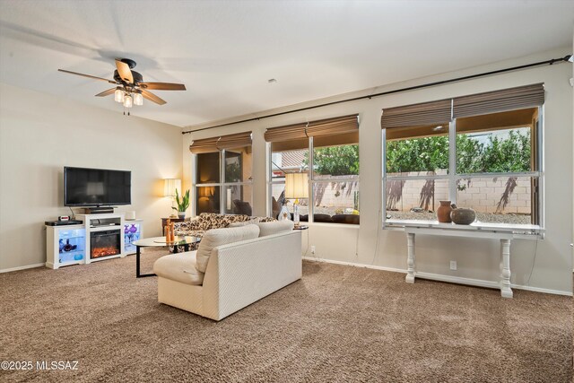 9860 N Western Sky Pl, Tucson, AZ 85742 - carpeted living area with ceiling fan and baseboards