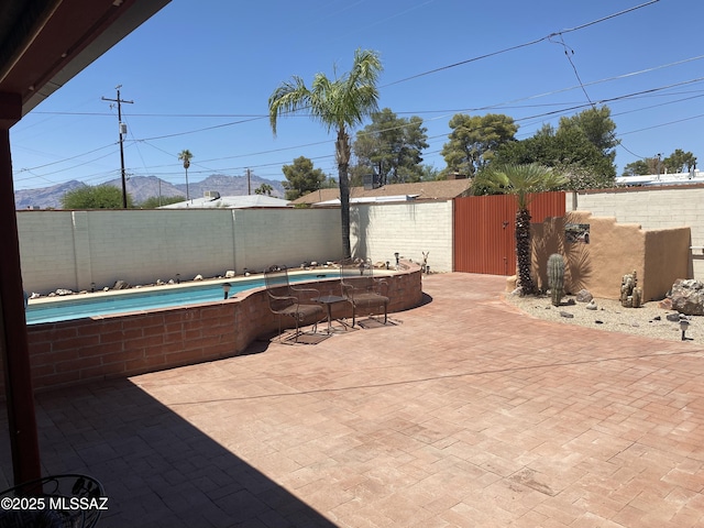 1117 S Carnegie Dr, Tucson, AZ 85710 - fenced backyard with a patio area