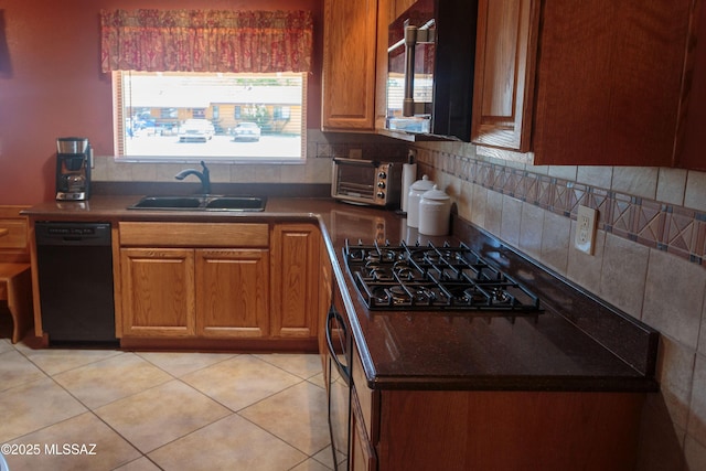 1117 S Carnegie Dr, Tucson, AZ 85710 - kitchen with black appliances, tasteful backsplash, brown cabinetry, and dark countertops