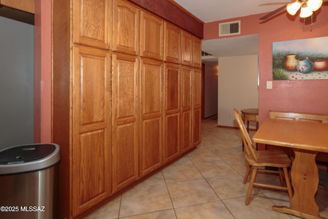 1117 S Carnegie Dr, Tucson, AZ 85710 - dining area with a ceiling fan and light tile patterned floors