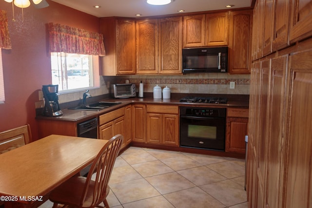 1117 S Carnegie Dr, Tucson, AZ 85710 - kitchen featuring black appliances, brown cabinetry, and recessed lighting
