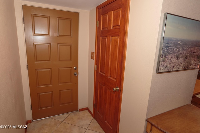 1117 S Carnegie Dr, Tucson, AZ 85710 - hallway featuring light tile patterned floors and baseboards