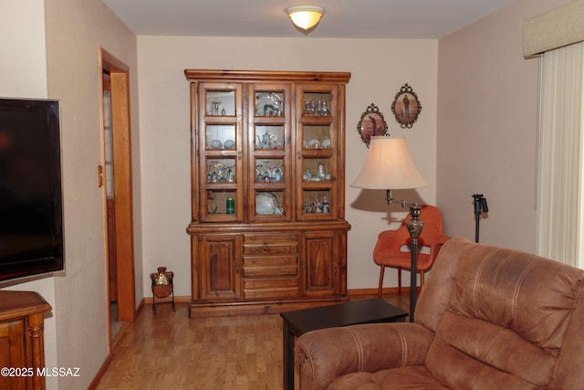 1117 S Carnegie Dr, Tucson, AZ 85710 - sitting room with light wood finished floors and baseboards