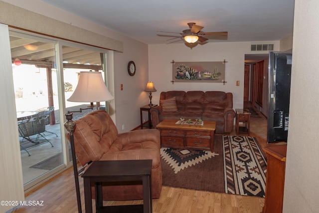 1117 S Carnegie Dr, Tucson, AZ 85710 - living room with wood finished floors and a ceiling fan