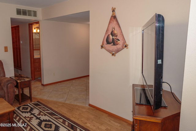 1117 S Carnegie Dr, Tucson, AZ 85710 - hallway with baseboards and light tile patterned floors