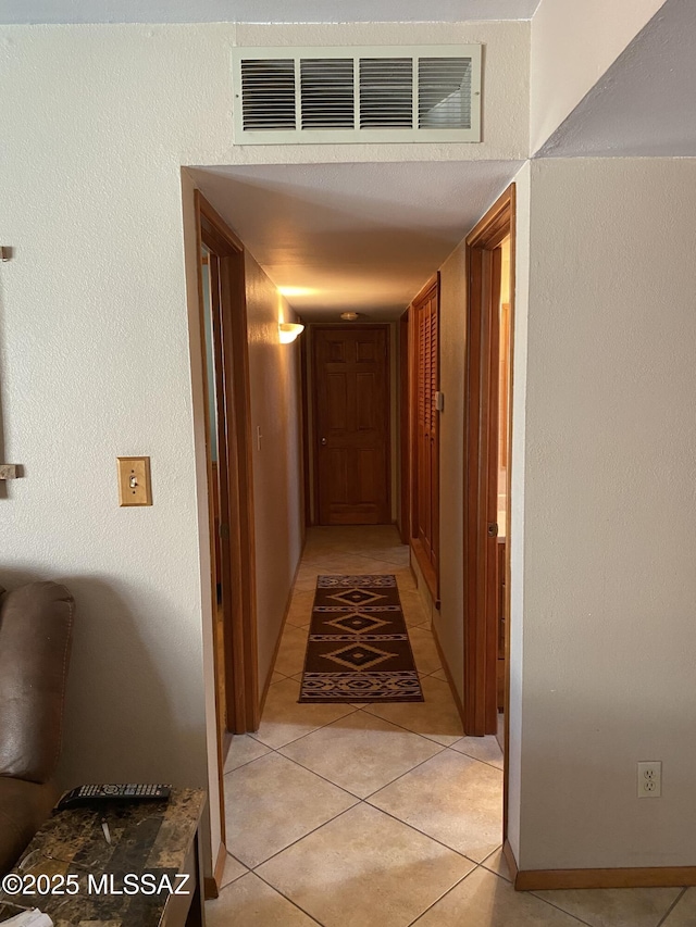1117 S Carnegie Dr, Tucson, AZ 85710 - hallway with light tile patterned floors