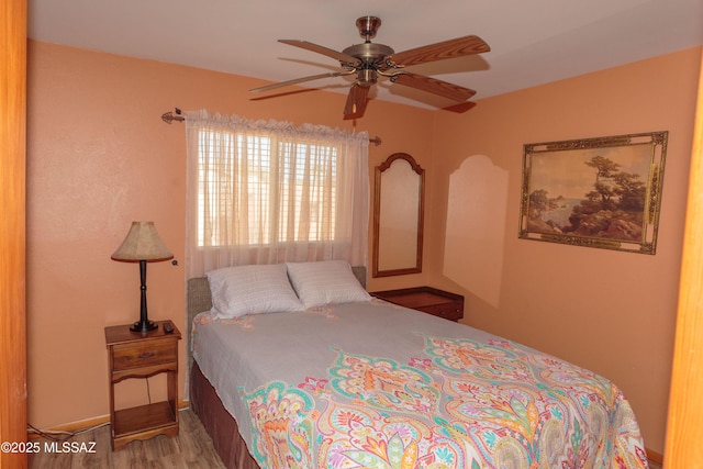 1117 S Carnegie Dr, Tucson, AZ 85710 - bedroom with wood finished floors and ceiling fan