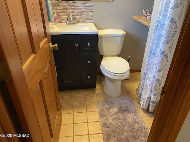 1117 S Carnegie Dr, Tucson, AZ 85710 - bathroom with vanity, tasteful backsplash, and tile patterned flooring