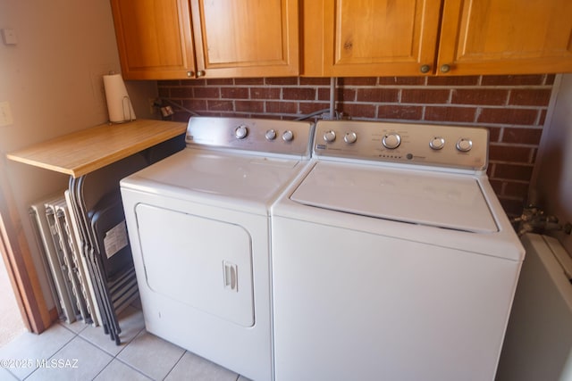 1117 S Carnegie Dr, Tucson, AZ 85710 - laundry room with independent washer and dryer and light tile patterned flooring