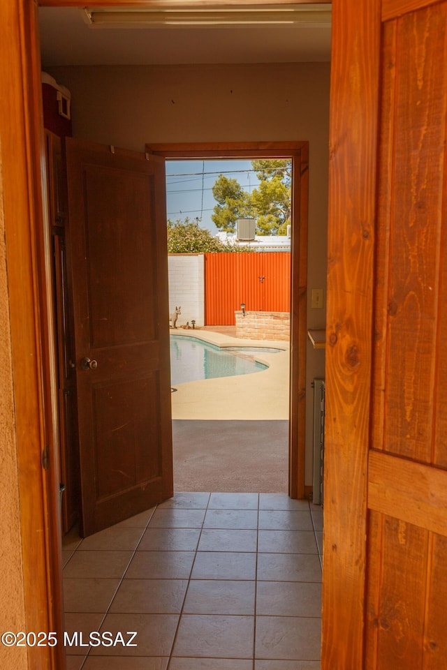 1117 S Carnegie Dr, Tucson, AZ 85710 - hall featuring carpet floors and tile patterned floors