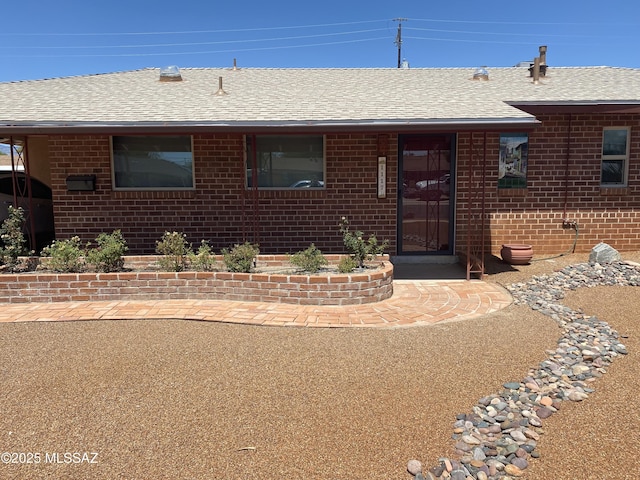 1117 S Carnegie Dr, Tucson, AZ 85710 - ranch-style home featuring brick siding and a shingled roof