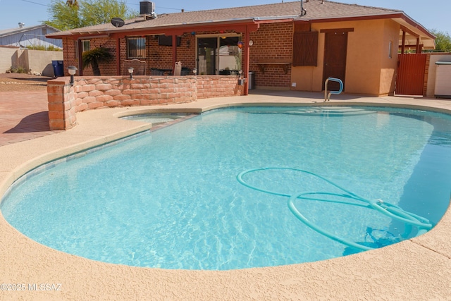 1117 S Carnegie Dr, Tucson, AZ 85710 - view of swimming pool with a patio and an in-ground hot tub