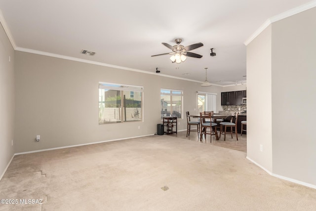 6733 S Stone Fly Dr, Tucson, AZ 85757 - living room featuring light colored carpet, crown molding, ceiling fan, and baseboards