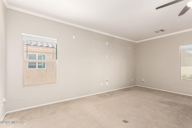 6733 S Stone Fly Dr, Tucson, AZ 85757 - empty room featuring light carpet, crown molding, a ceiling fan, and baseboards